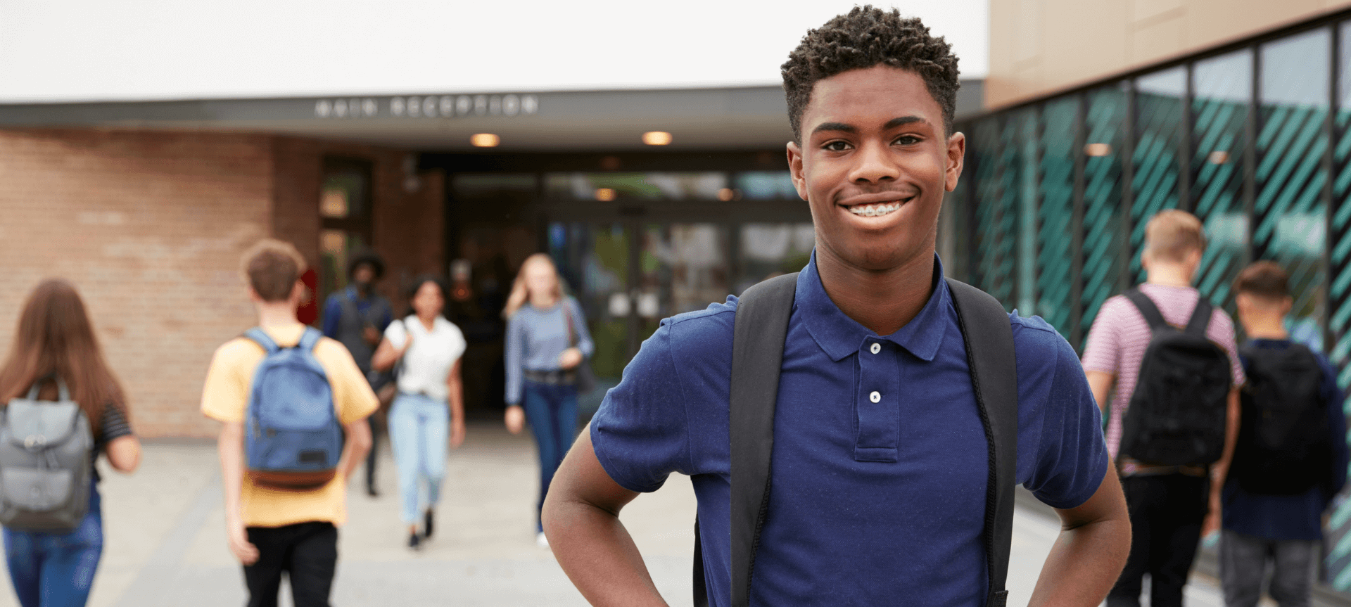 Male Student Outside Of Building